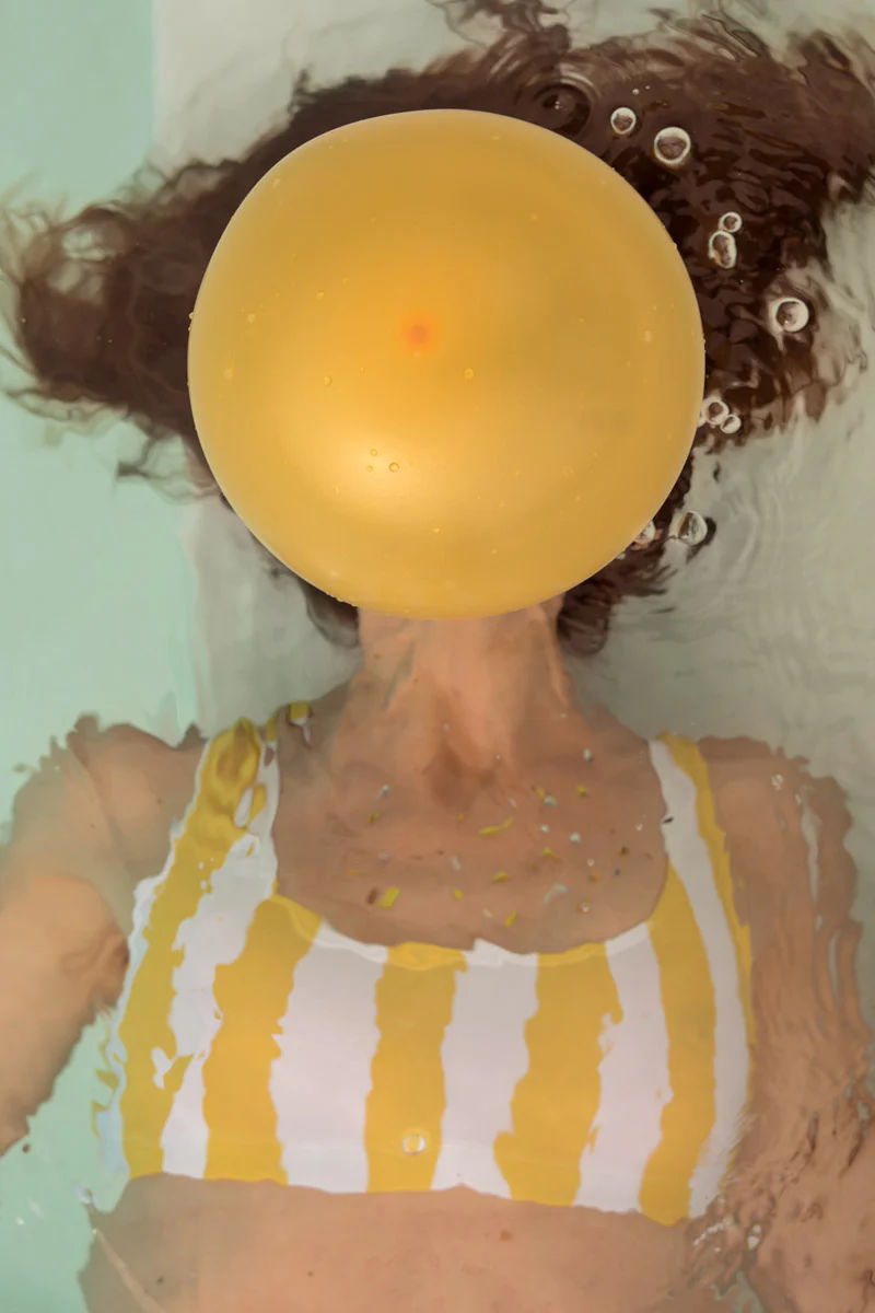 photograph of swimmer blowing up a balloon by Carla Sutera Sardo